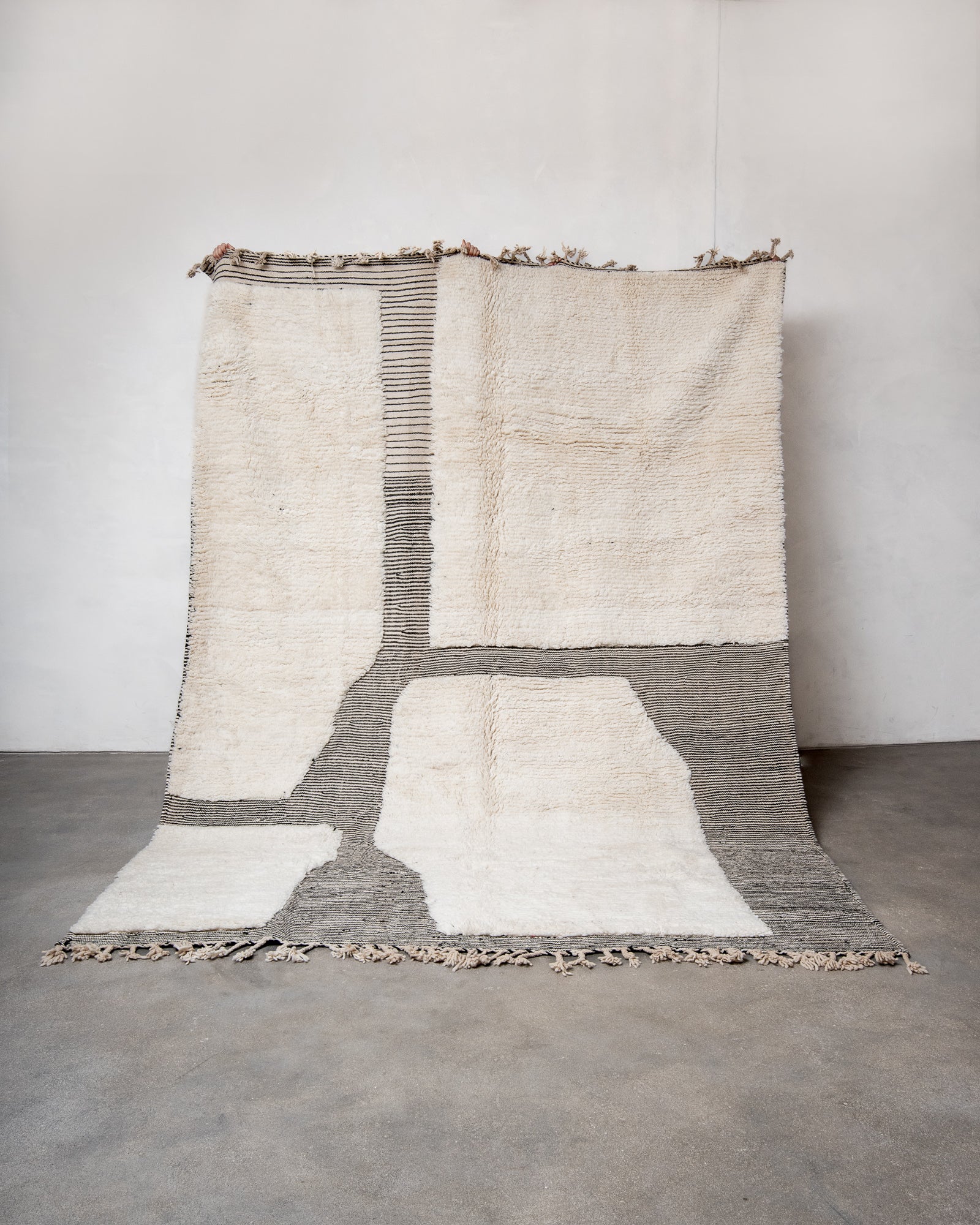 Modern, designer, handcrafted Berber rug from Morocco. Beniourain carpet with beautiful colours and patterns and fluffy wool texture.